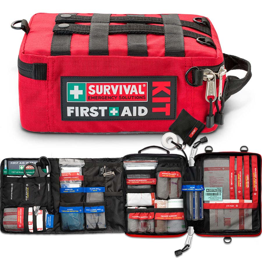 Red SURVIVAL first aid case closed and opened, showing the colour-coded compartments