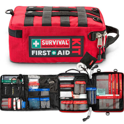 Red SURVIVAL first aid case closed and opened, showing the colour-coded compartments