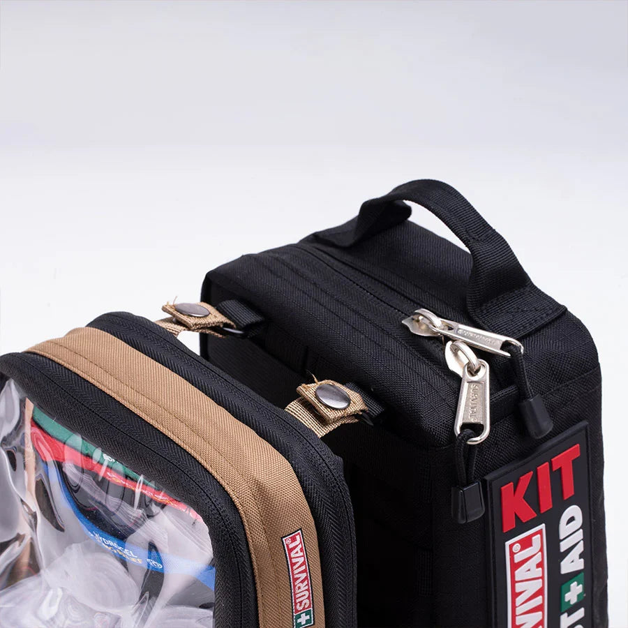 Remote and Outdoor module clipped onto a red SURVIVAL first aid case