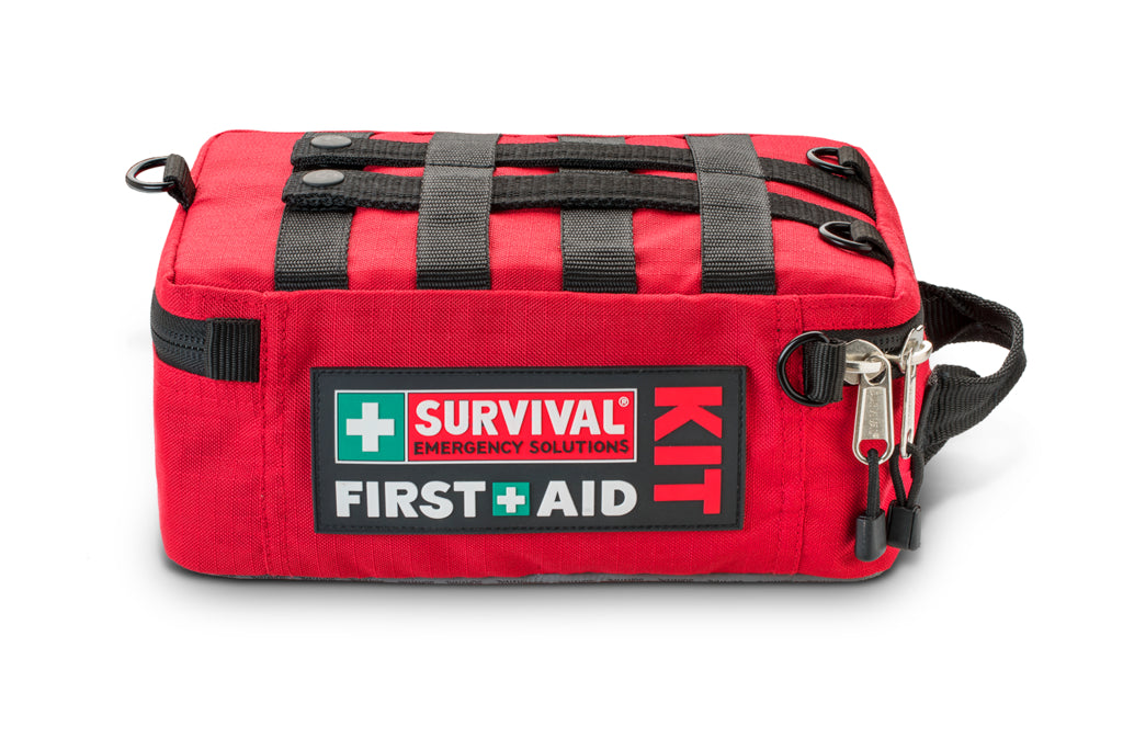 Red Family case lying flat, closed, with the shoulder strap