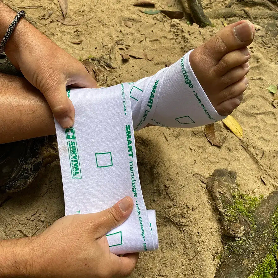 SMART bandage being applied to an ankle outdoors